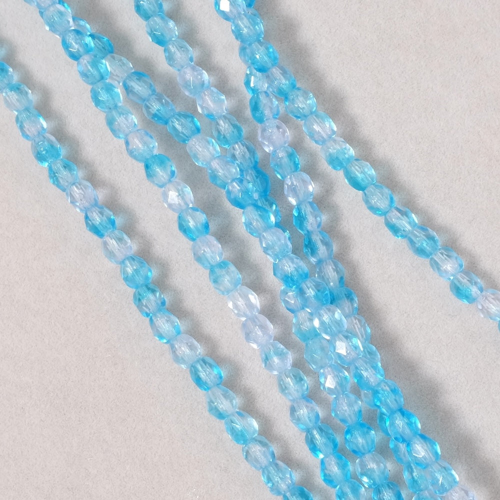 Fil de perles de Bohème rondes facettées 4mm bleu transparent